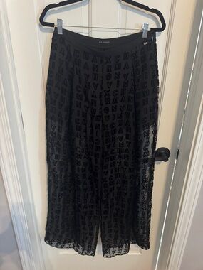 Armani Exchange Black Semi-Sheer pants with Logo Overlay.
